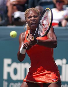 Third seed Serena Williams, USA returns a shot during her 7-6 (7-3), 6-3 victory over Natalie Dechy, at the Family Circle Cup Tennis Tournament on Daniel Island in Charleston, South Carolina, while hundreds of Charleston Air Force Base (AFB) personnel volunteer to help provide security for the tournament.